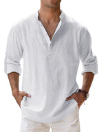 Man wearing a white linen shirt with rolled-up sleeves against a light blue background