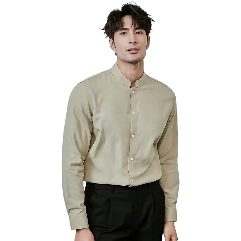 Man wearing a beige long-sleeve shirt with a white background