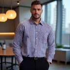 Man wearing a blue and white checkered shirt in an office setting