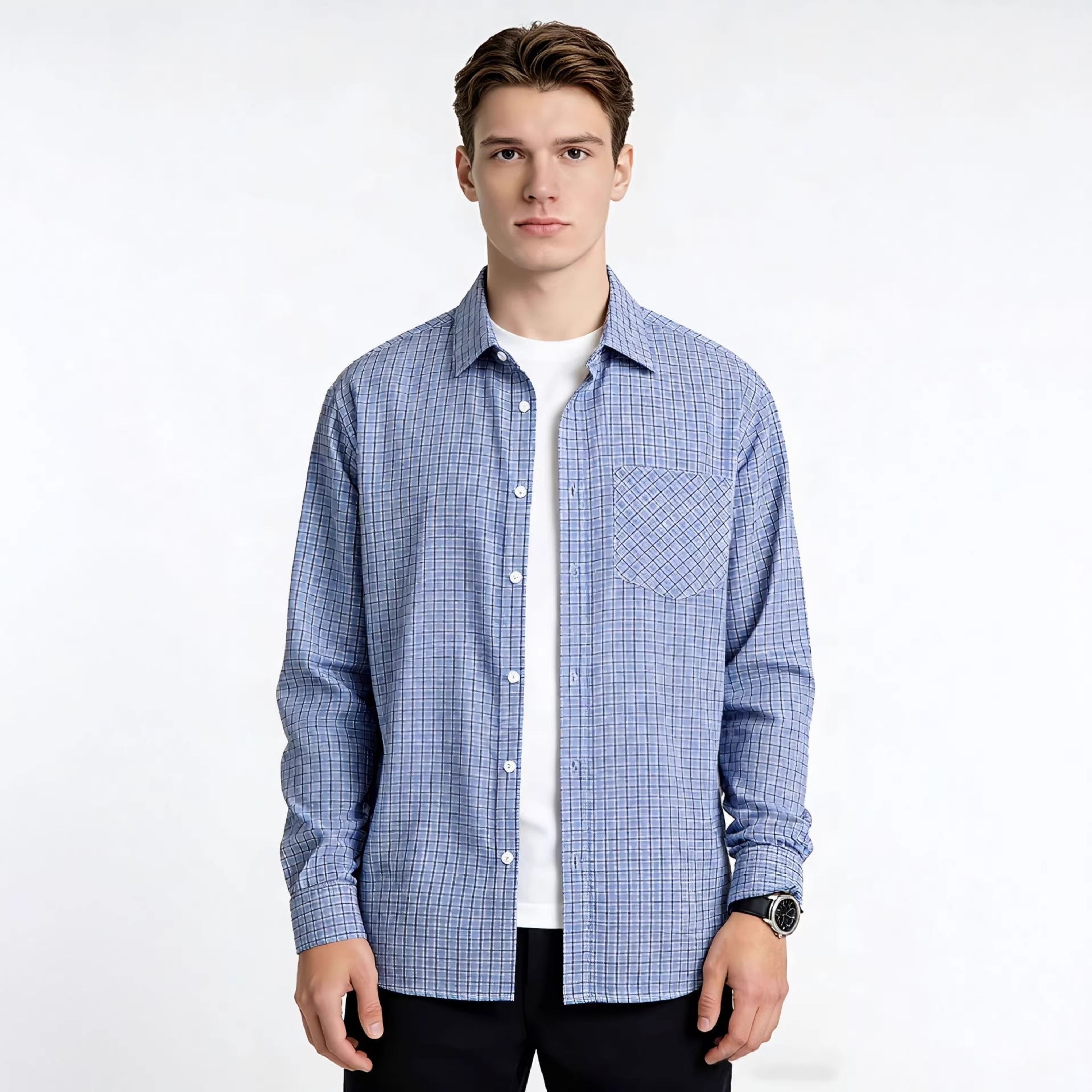 Man wearing a blue checkered shirt over a white t-shirt on a white background