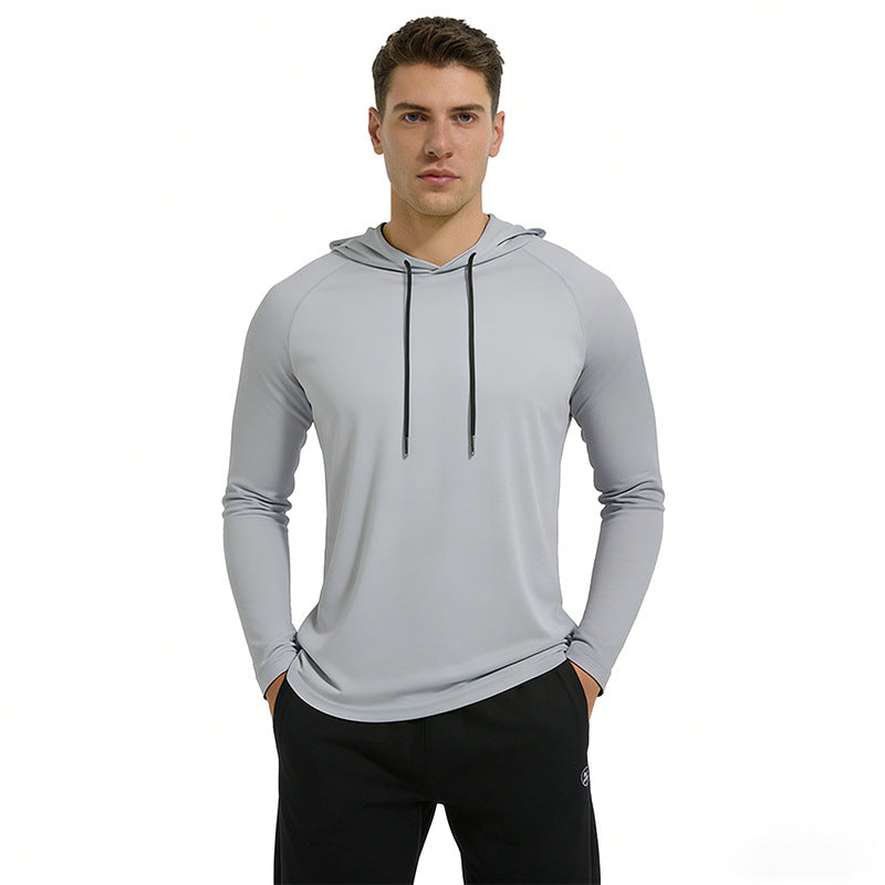 Man wearing a gray hoodie with black drawstrings on a white background