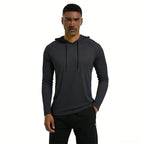 Man wearing a black hoodie and pants on a white background