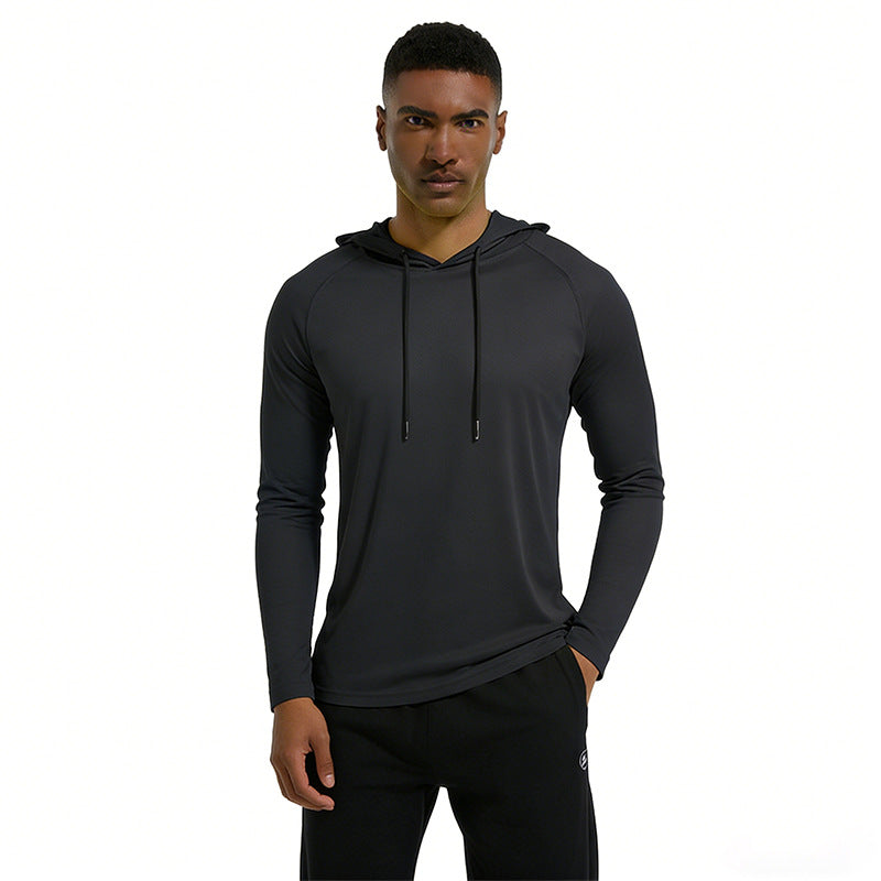 Man wearing a black hoodie and pants on a white background