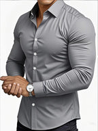 Gray button-up shirt worn by a person on a white background