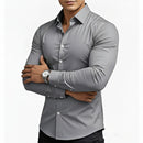 Gray button-up shirt worn by a person on a white background