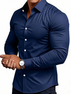 Navy blue shirt worn by a person on a white background