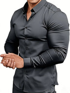 Gray button-up shirt worn by a person on a white background