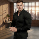 Person wearing a black dress shirt on a plain background