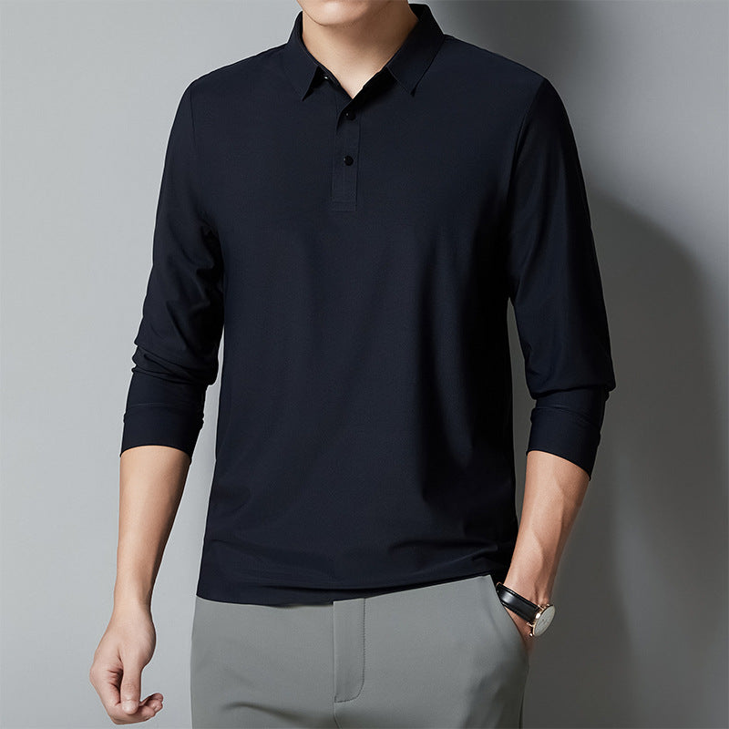 Person wearing a black long-sleeve polo shirt against a gray background