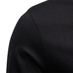 Close-up of a black long-sleeve shirt on a white background