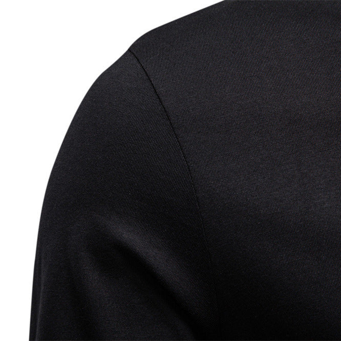 Close-up of a black long-sleeve shirt on a white background