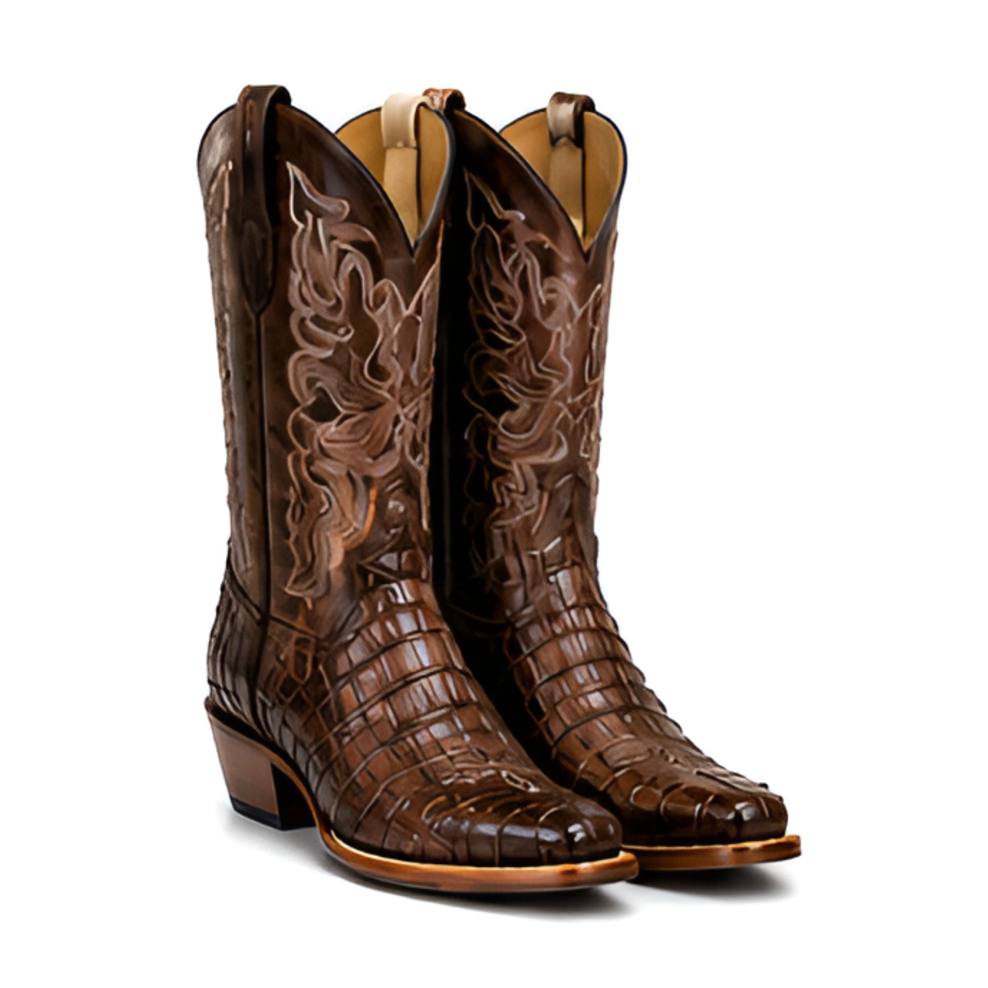 A pair of dark brown western cowboy boots with embossed crocodile skin texture, floral tooled shafts, and low stacked heels, shown on a plain white background.